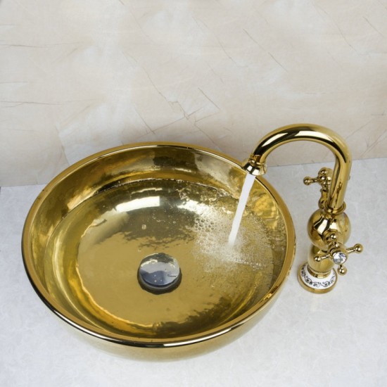 Gouden afgewerkte wastafel kraan met hand geschilderde goudkleurige glazen waskom