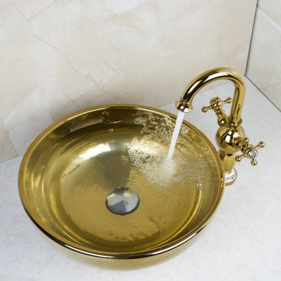 Gouden afgewerkte wastafel kraan met hand geschilderde goudkleurige glazen waskom